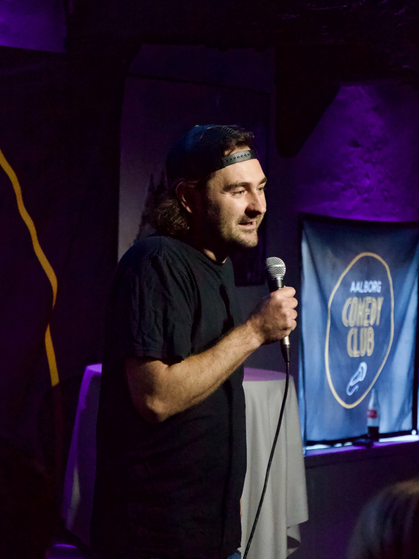Gammelby Janssen performing stand-up comedy at Aalborg Comedy Club in Denmark